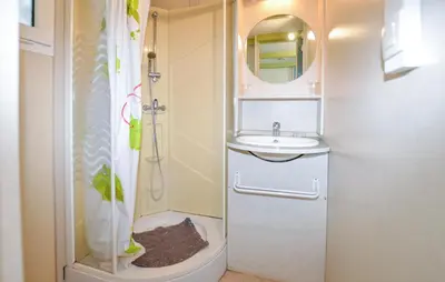 a small bathroom with a sink and a shower at Gorgeous Stacaravan In Casalabriva in Casalabriva