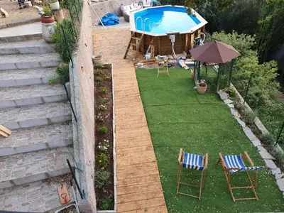 an aerial view of a backyard with a pool and chairs at Fozzano in Fozzano