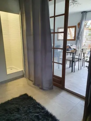 a room with a sliding glass door and a table with chairs at Fozzano in Fozzano
