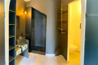 a bathroom with a shower and a sink and a toilet at Bas de Villa indépendant San Benedetto in Alata