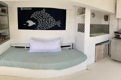 a small room with a bed in a kitchen at Bas de Villa indépendant San Benedetto in Alata