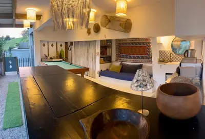 a living room with a large table and a pool table at Bas de Villa indépendant San Benedetto in Alata