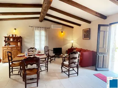 a dining room with a table and chairs at A Sérénità - Bergerie - Piscine Privée in Porto-Vecchio
