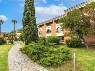 a tree in front of a building with a stone path at Apartment Casa Antonio by Interhome in Linguizzetta