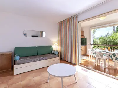 a living room with a couch and a table at Apartment Casa Antonio by Interhome in Linguizzetta