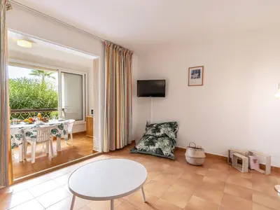 a living room with a table and a dining room at Apartment Casa Antonio by Interhome in Linguizzetta