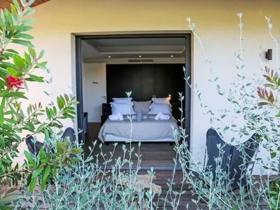 a bedroom with a bed with white pillows at Villa La Cupulatta by Interhome in Sainte-Lucie de Porto-Vecchio