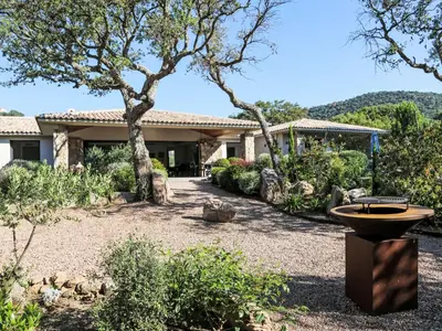 a house with a bird bath in the yard at Villa La Cupulatta by Interhome in Sainte-Lucie de Porto-Vecchio