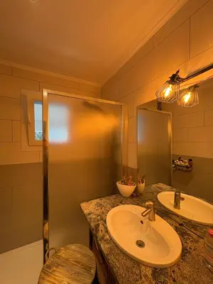 a bathroom with a sink and a mirror at Villa avec piscine in Alata