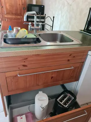 a sink in a kitchen with a toilet under it at Casa Ghjadda - gite ombragé avec accès piscine - in Appietto