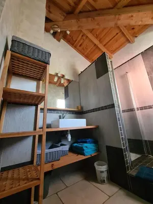 a room with two bunk beds and a ladder at Casa Ghjadda - gite ombragé avec accès piscine - in Appietto