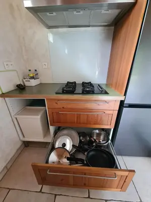 a small kitchen with a stove and a sink at Casa Ghjadda - gite ombragé avec accès piscine - in Appietto