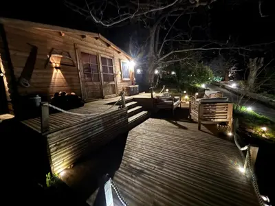 a night view of a house with lights in the dark at Chalet studio in Porto Ota