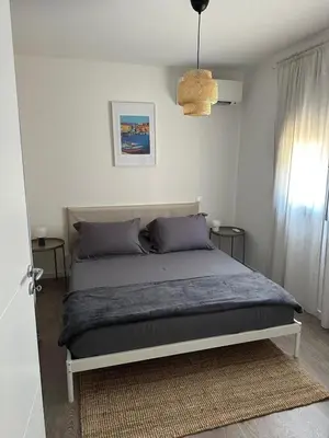 a bedroom with a bed in a room at Casa Juliette Maison bois in Aléria