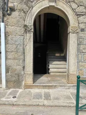 an entrance to a building with an open door at Lovely apartment in Sartène in Sartène