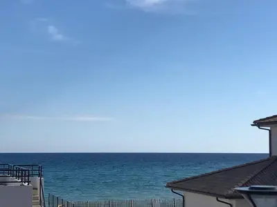 a view of the ocean from a house at PDM Appartement Paese di Mare in Santa-Lucia-di-Moriani