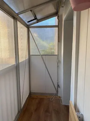an empty room with a large window in a room at OTA T2 proche rivières et plages, randonnées in Guaita