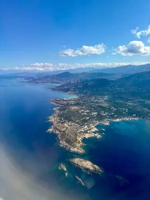 an aerial view of a island in the water at T3 Baie de Calvi jardin panoramique vue mer in Calenzana