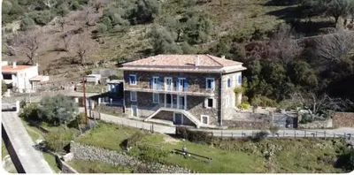 a large house on the side of a hill at Appartement Caprunale Rivière & Maquis in Manso