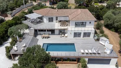 an aerial view of a house with a swimming pool at Villa avec piscine et vue mer à 230m de la plage in Zonza