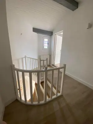 an empty room with a staircase in a house at Villa Saint-Cyprien Corse in Lecci
