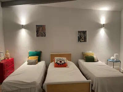 a bedroom with two beds with pillows on them at Villa Saint-Cyprien Corse in Lecci
