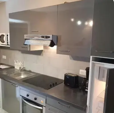 a kitchen with a sink and a counter top at Appartement Saltare Rivière & maquis in Manso