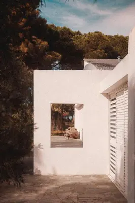 a painting of a dog laying on the side of a white house at Elegant Architect-Designed Home In Upper Corsica in Taglio-Isolaccio