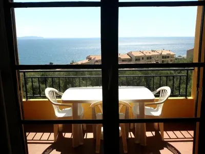 a view of a balcony with a table and chairs at Location corsica in Ajaccio