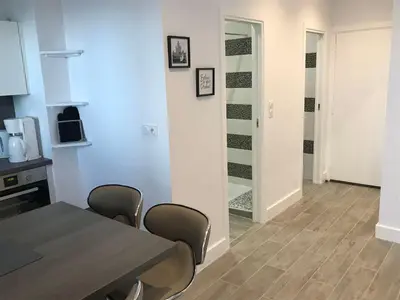 a kitchen and dining room with a table and chairs at Location corsica in Ajaccio