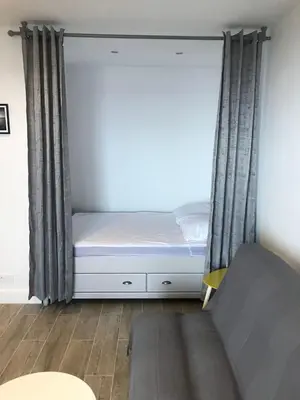 a small bedroom with a bed and a window at Location corsica in Ajaccio
