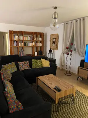 a living room with a couch and a coffee table at Villa CORSE in Solaro