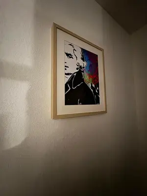 a picture of a man hanging on a wall at Studio Gare Corte in Corte