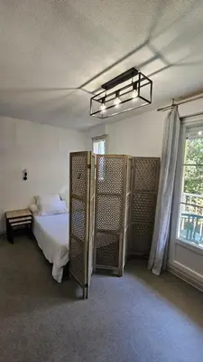 a bedroom with a bed and a window at Studio Gare Corte in Corte