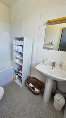 a bathroom with a sink and a toilet and a mirror at Studio Gare Corte in Corte