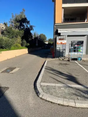 an empty street in front of a building at CASA LOUNA 2 Pièces à 150 m de la plage et du centre vile in Sari Solenzara