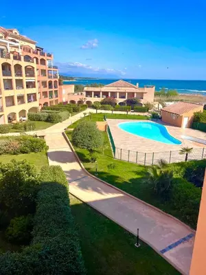 an aerial view of a resort with a swimming pool at CASA LOUNA 2 Pièces à 150 m de la plage et du centre vile in Sari Solenzara