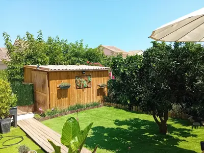 a garden with a wooden shed in a yard at Villa de luxe en bord de mer Résidence Torra Mare a Prunete in Cervione