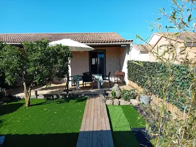 a house with a yard with green grass at Villa de luxe en bord de mer Résidence Torra Mare a Prunete in Cervione