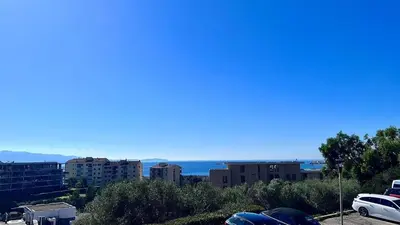 a view of a city from a parking lot at Casamea - Vue Mer, Clim & Parking, Proche Plage in Ajaccio
