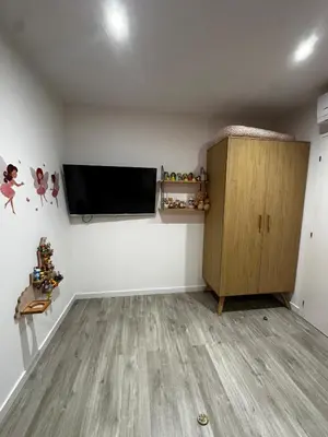 a living room with a flat screen tv on a wall at Magnifique Villa avec piscine et jacuzzi in Alata