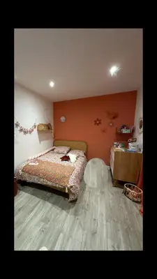 a bedroom with a bed and a wooden floor at Magnifique Villa avec piscine et jacuzzi in Alata