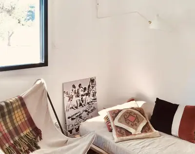 a living room with a couch and a picture on the wall at Casa di a felicita in Bonifacio