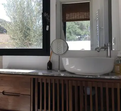 a bathroom sink with a mirror on a counter at Casa di a felicita in Bonifacio