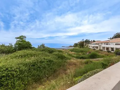 a view of the ocean from the side of a road at Studio Brigitte by Interhome in Linguizzetta