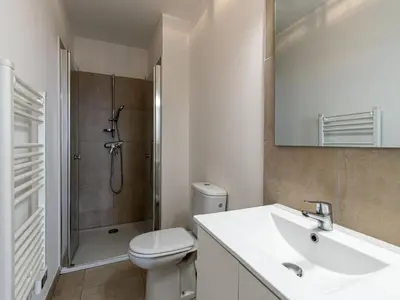 a bathroom with a sink and a toilet and a shower at Studio Brigitte by Interhome in Linguizzetta