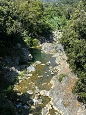 an aerial view of a river with rocks and trees at Appart, résidentiel penta-di-Casinca in Penta-di-Casinca