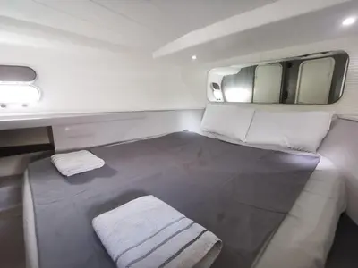 a small room with a bed in an airplane at appartement flottant in Ajaccio