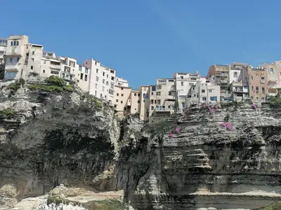 a group of buildings on top of a mountain at villa dans petite résidence avec piscine à 10 minutes des plages proche PORTO VECCHIO in Porto-Vecchio