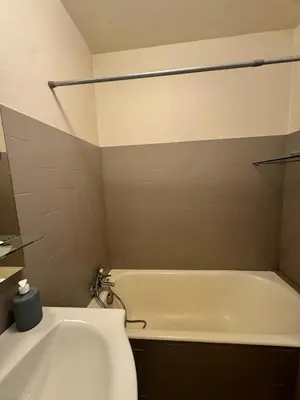 a bathroom with a white tub and a toilet at Studio cosy au cœur de Propriano in Propriano